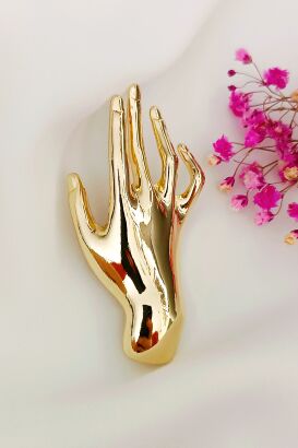 Minimalistyczna broszka dłoń