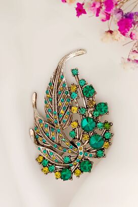 Liście z zielonymi i żółtymi cyrkoniami